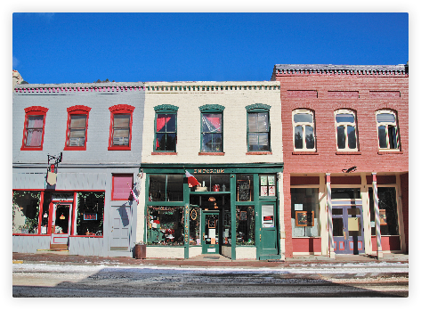 Colorful two story buildings with storefronts