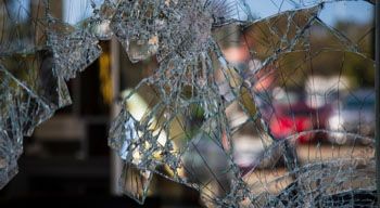 close-up of shattered glass window